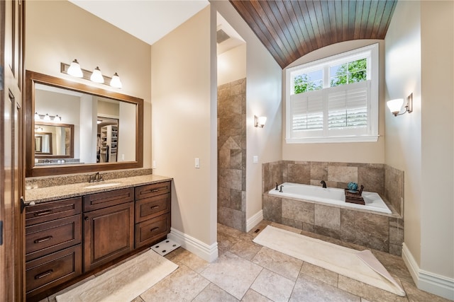 bathroom featuring wood ceiling, vanity, lofted ceiling, and a relaxing tiled tub