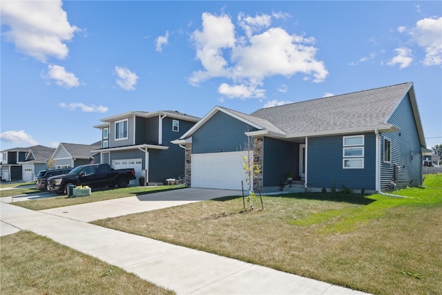 view of front of home featuring a front yard and a garage