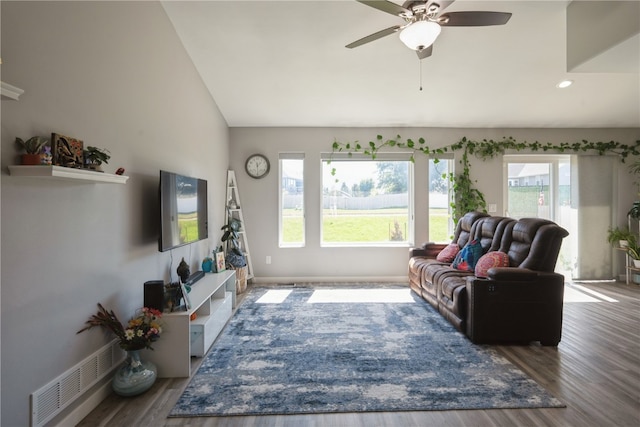 living room with ceiling fan, hardwood / wood-style flooring, and plenty of natural light