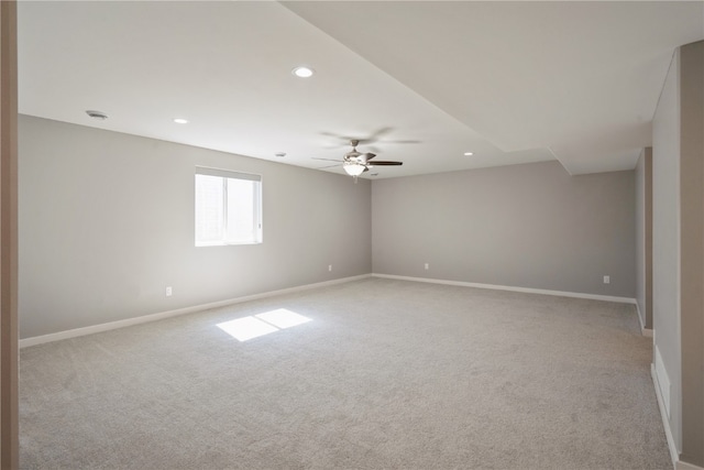 unfurnished room featuring light carpet and ceiling fan