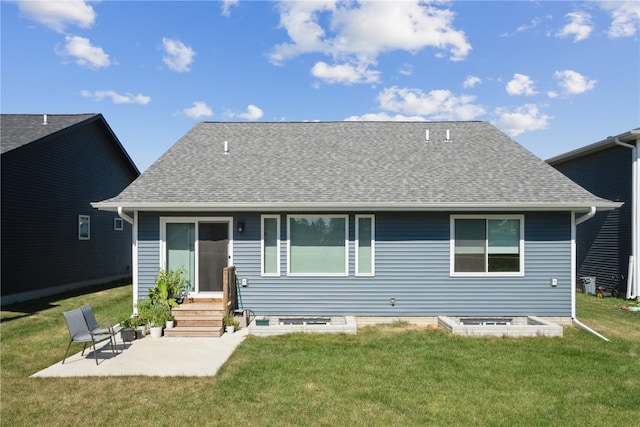 back of property featuring a lawn and a patio area