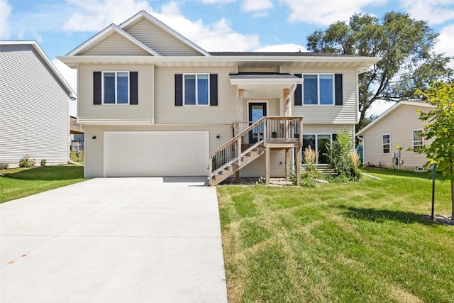 raised ranch with a garage and a front lawn