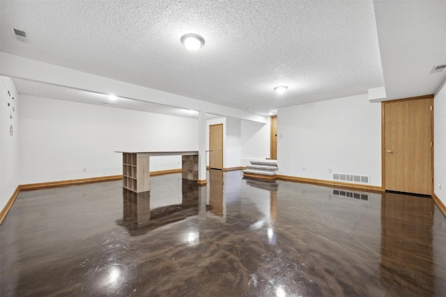 basement with a textured ceiling