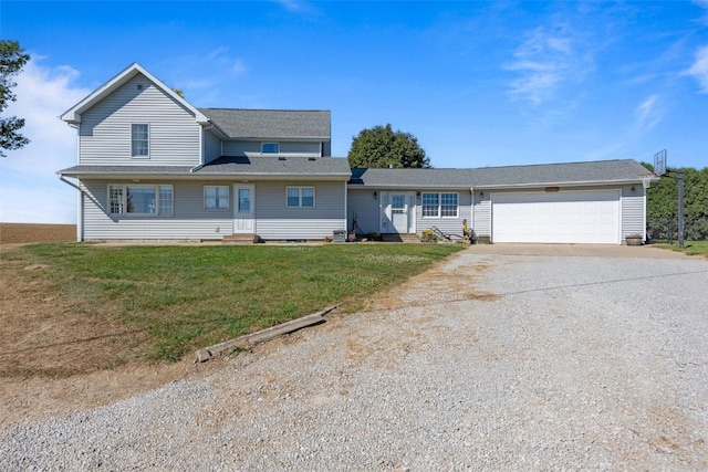 view of front of home featuring a garage and a front yard