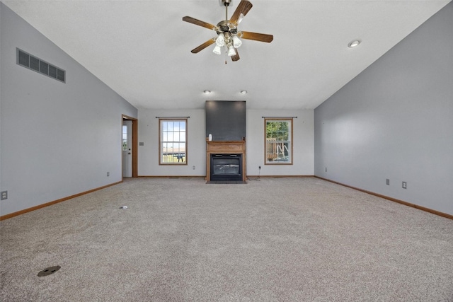 unfurnished living room featuring ceiling fan, light carpet, and vaulted ceiling