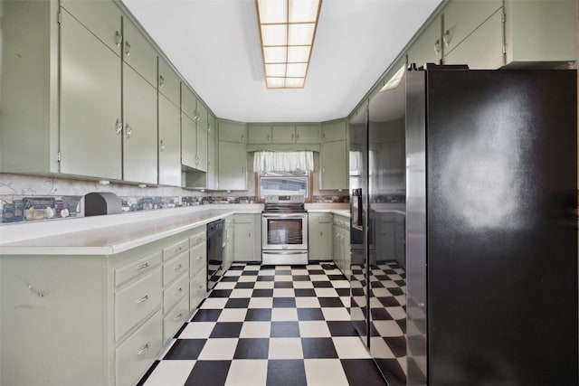 kitchen with green cabinetry, appliances with stainless steel finishes, and tasteful backsplash