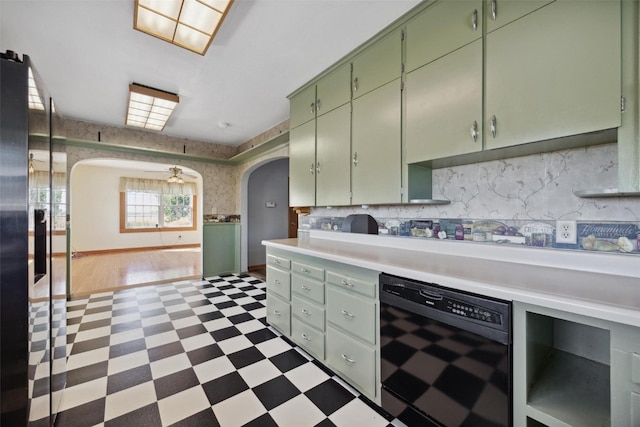 kitchen featuring black dishwasher and green cabinets