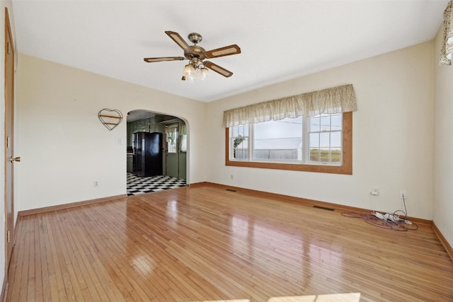 spare room with ceiling fan and light hardwood / wood-style flooring