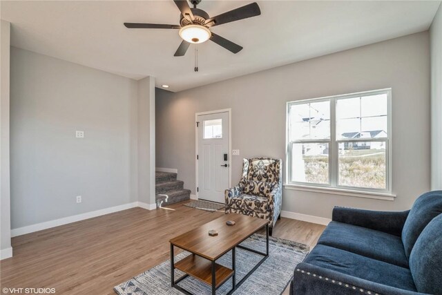 living room with ceiling fan and wood-type flooring