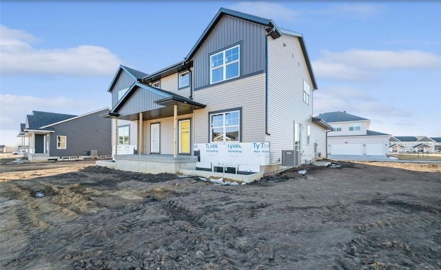 view of front facade with a porch and central air condition unit