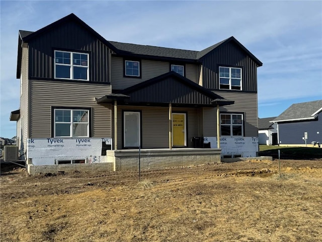 view of front of property with central AC unit and a porch