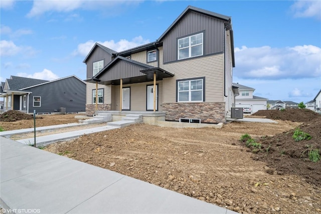2398 Bluegrass St, Marion, IA 52302 - craftsman-style home with board and batten siding, a porch, and stone siding