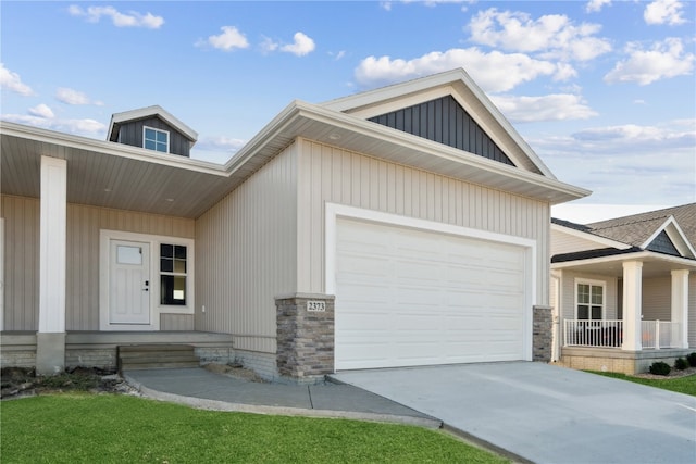 view of front of house with a garage and a porch