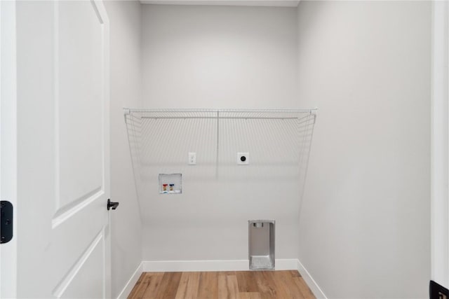 washroom with washer hookup, hardwood / wood-style floors, and hookup for an electric dryer