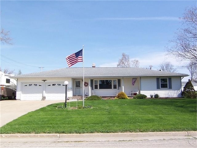 ranch-style home with a front lawn and a garage