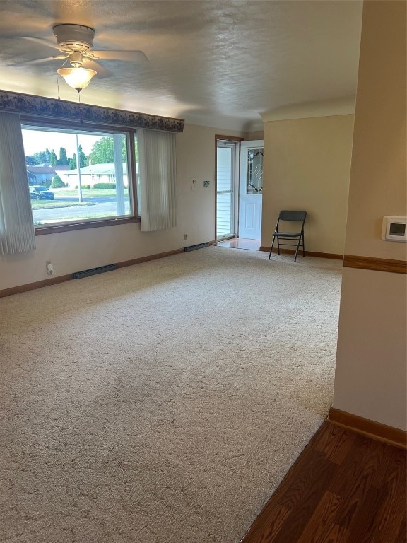 unfurnished room with ceiling fan and hardwood / wood-style floors