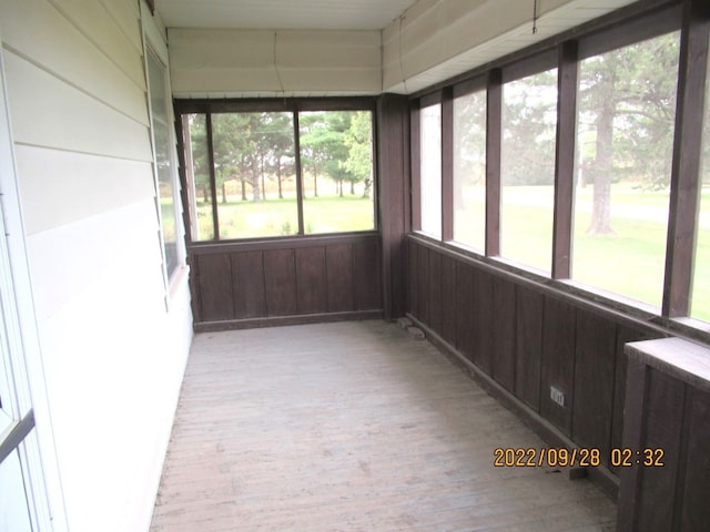 unfurnished sunroom with a healthy amount of sunlight