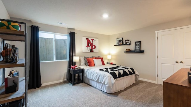 carpeted bedroom with a closet