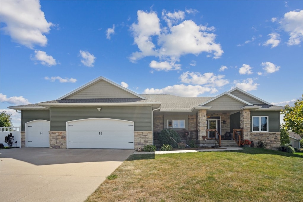 view of front of property featuring a garage and a front yard