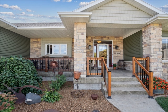 view of exterior entry featuring a porch