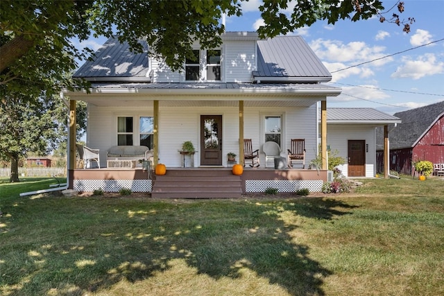 exterior space featuring a porch and a lawn