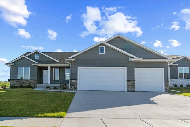 craftsman-style house with a garage and a front lawn