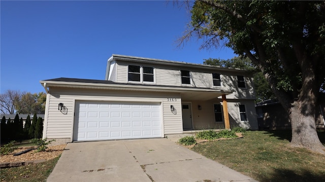 view of front of house with a garage and a front yard