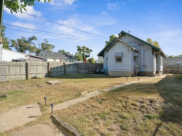 view of home's exterior featuring a yard