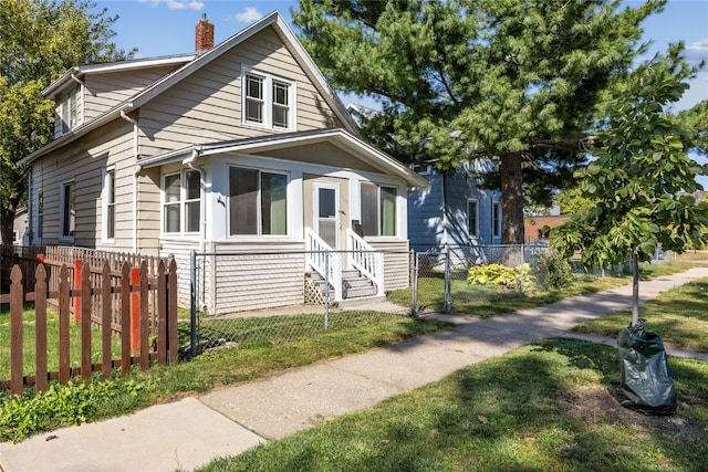 bungalow with a front yard