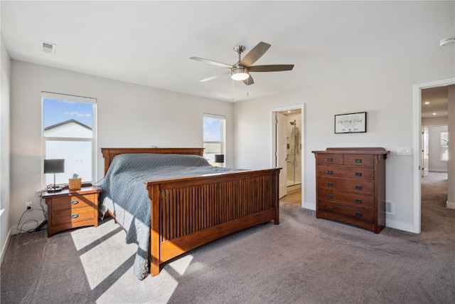 carpeted bedroom featuring ceiling fan and ensuite bathroom