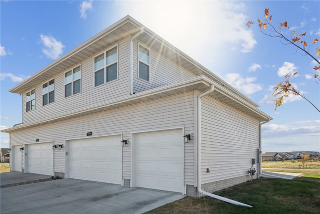 view of side of home featuring a garage