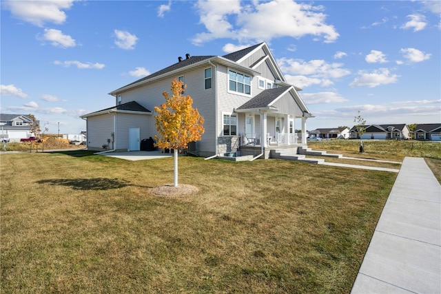 exterior space with a lawn and a porch