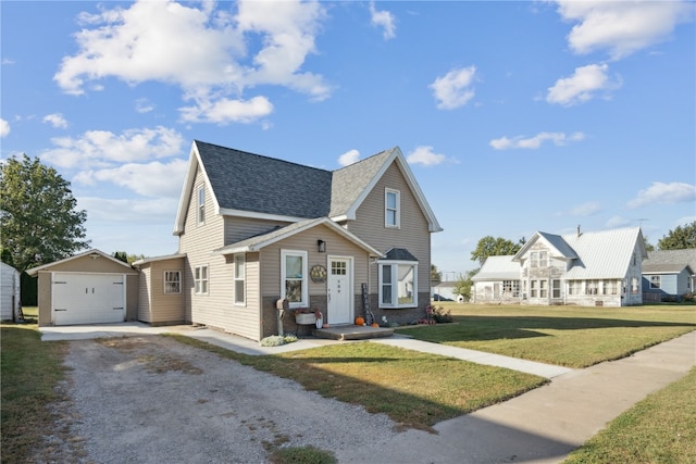 view of front of property featuring an outdoor structure, a garage, and a front yard