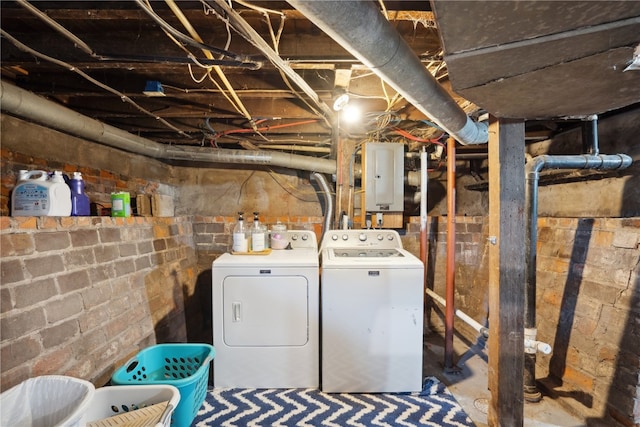 washroom with washer and clothes dryer and electric panel