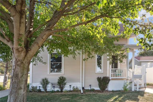 view of home's exterior with a lawn