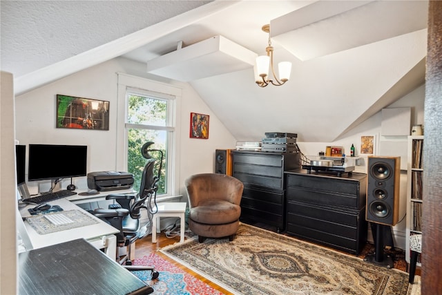 office space with an inviting chandelier, hardwood / wood-style flooring, lofted ceiling, and a textured ceiling