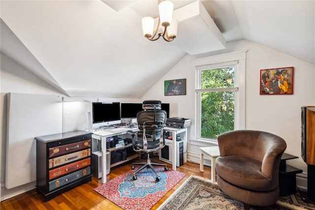 home office featuring wood-type flooring, vaulted ceiling, and a chandelier