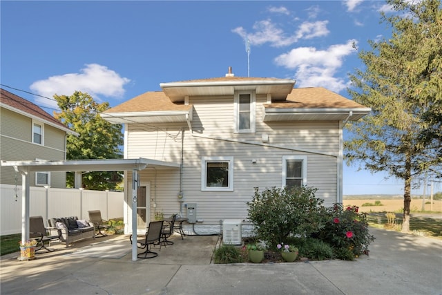 back of house with a patio