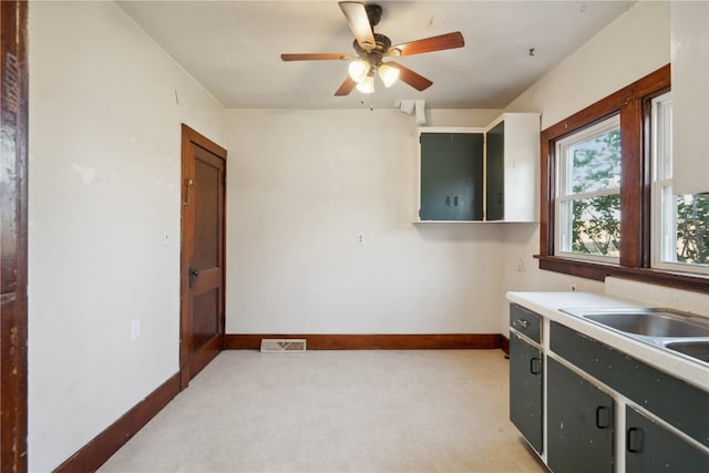 kitchen featuring ceiling fan