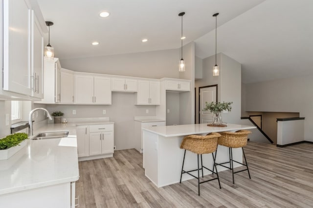 kitchen with white cabinetry and a center island