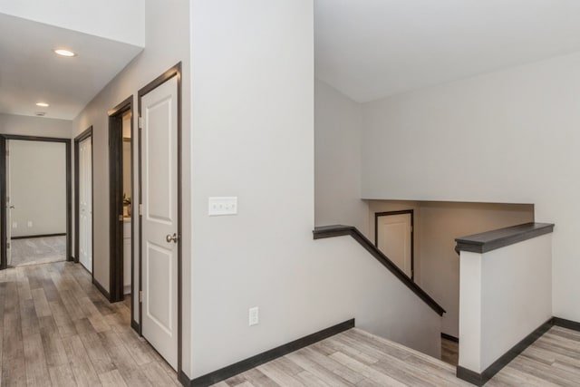 stairs featuring wood-type flooring