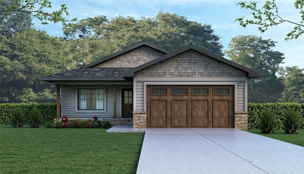 craftsman inspired home with a garage and a front yard