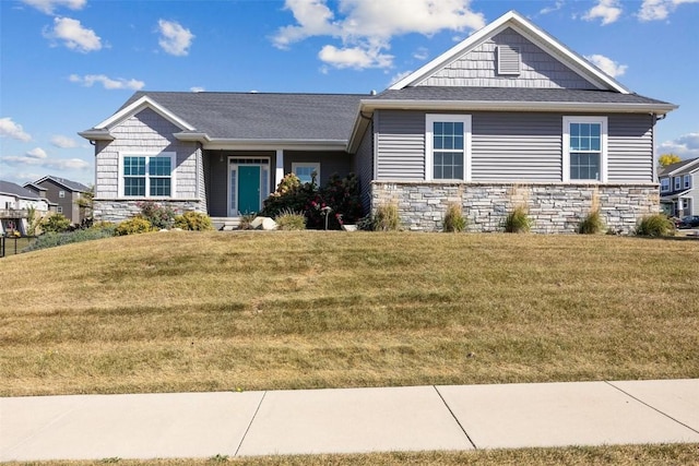 craftsman-style house with a front yard