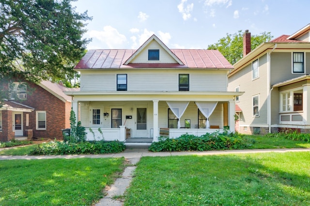 view of front facade with a porch and a front yard