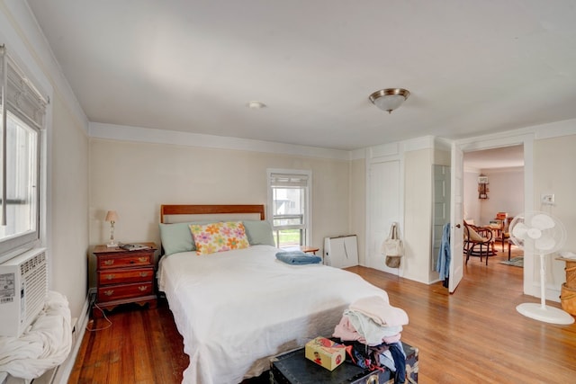 bedroom with hardwood / wood-style floors