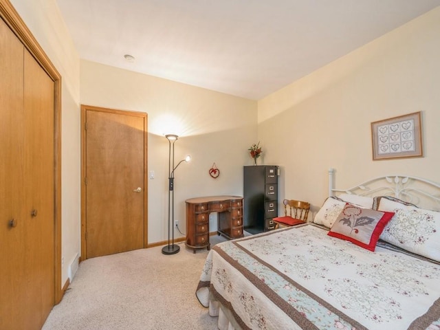 carpeted bedroom with baseboards