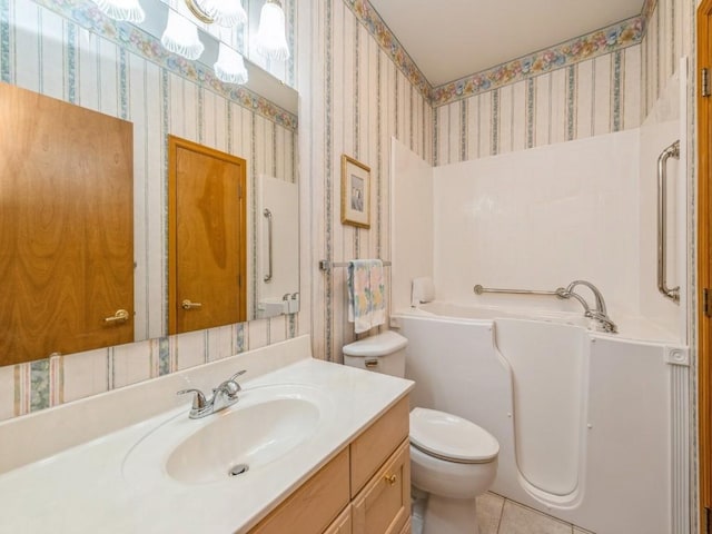 bathroom with wallpapered walls, toilet, tile patterned floors, vanity, and a bath