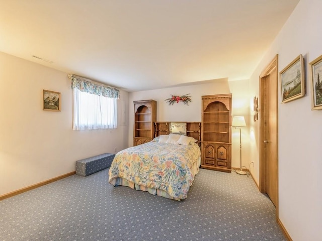 carpeted bedroom with baseboards