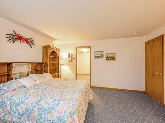 carpeted bedroom with baseboards