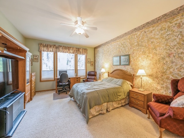 bedroom with ceiling fan and light colored carpet